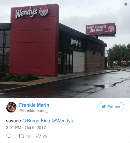 tweet screenshot showing BK billboard right next to a Wendy's